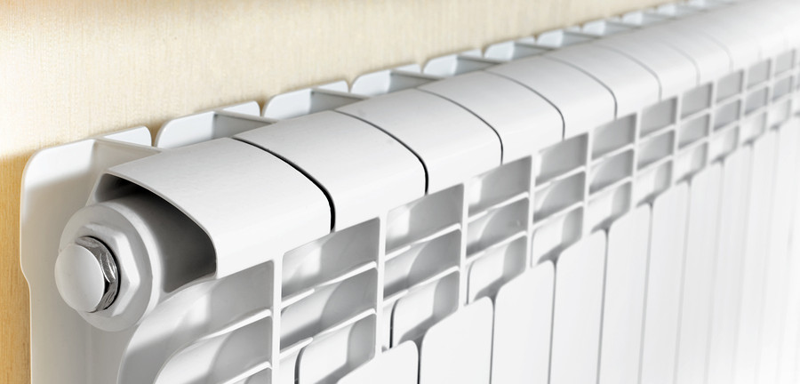 What are Baseboard Heaters? 6 Baseboard heater installed along a wall, showcasing its efficient design and suitability for home heating.