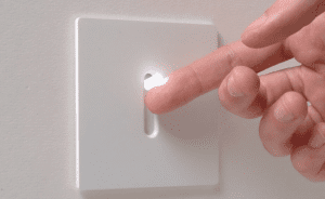 Person flipping a light switch