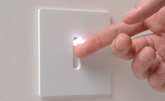 Person flipping a light switch